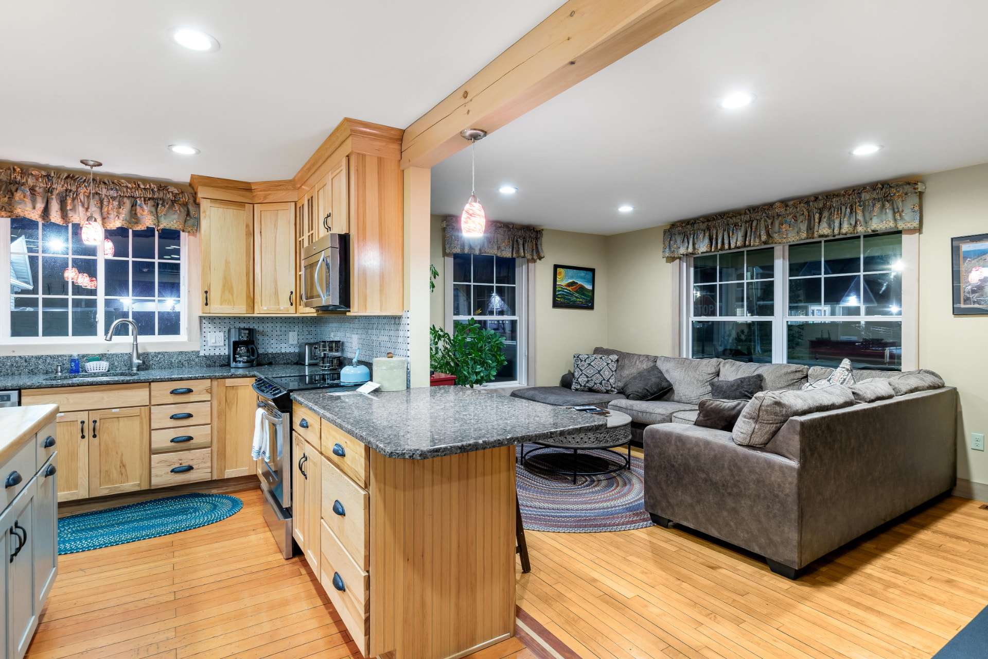 Kitchen open to the living room in the evening