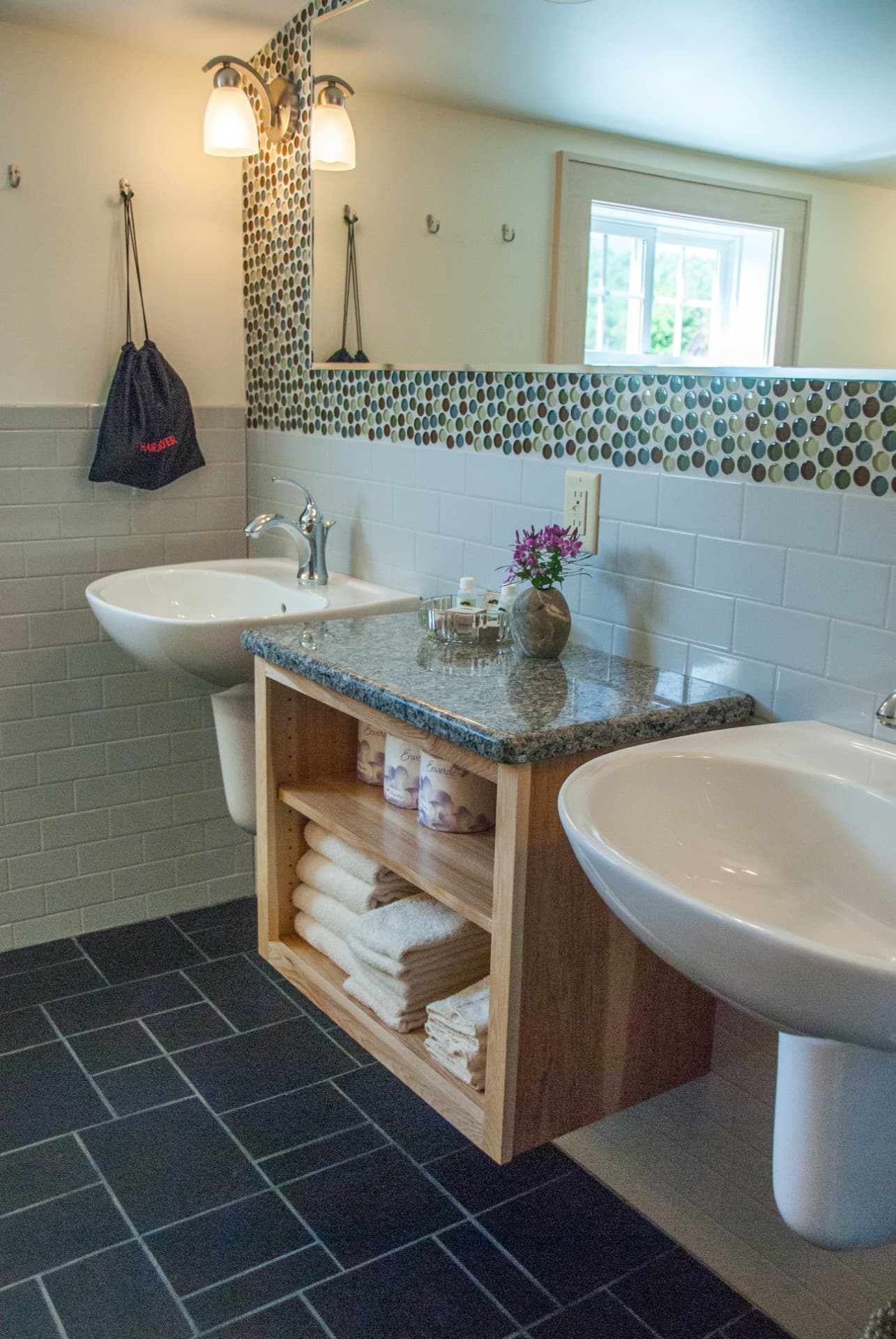 Bathroom with double vessel sinks and slate tile at Mt. Moriah Cottage