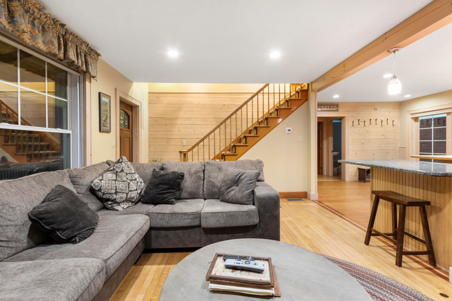 Living room looking toward the staircase and entry